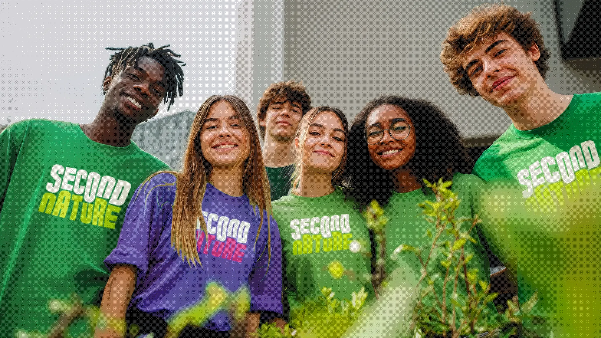 Young adults smiling in Second Nature merch